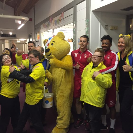 Pudsey with children from Unique Kidz and Co and footballers from Morecambe Football Club